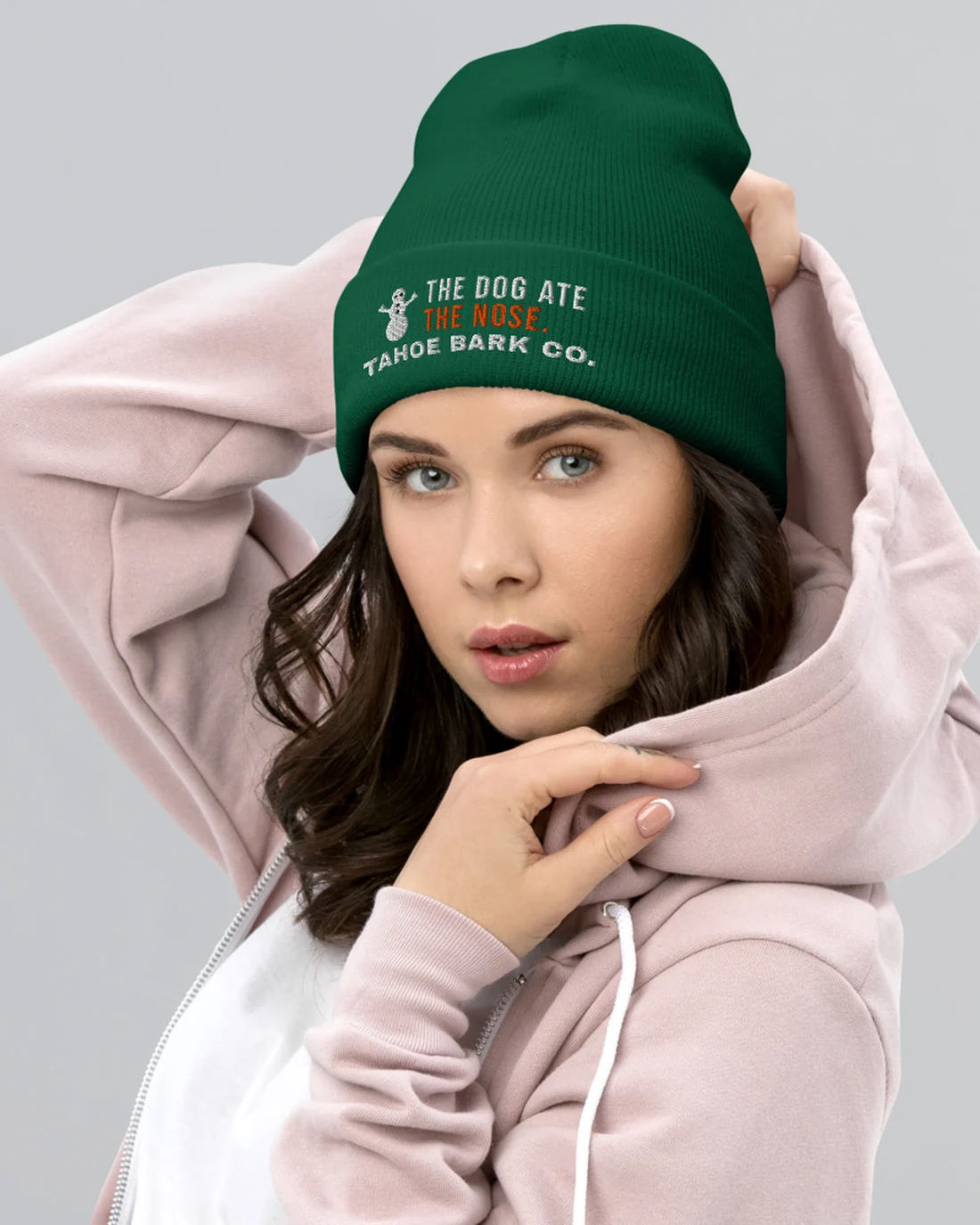 The Dog Ate the Nose design on a beanie, worn by a model.