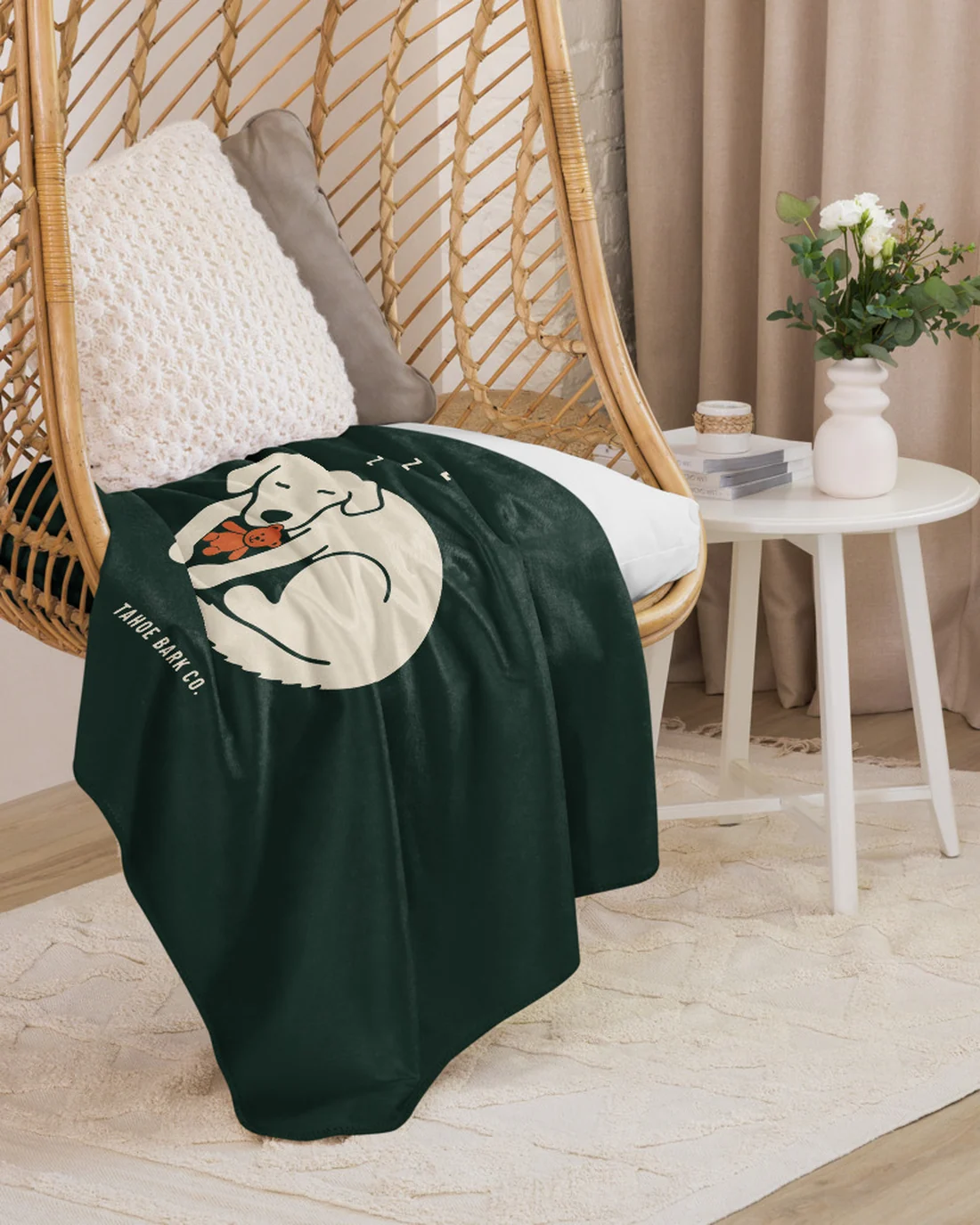 The Curled design on a blanket, draped over a hanging chair.