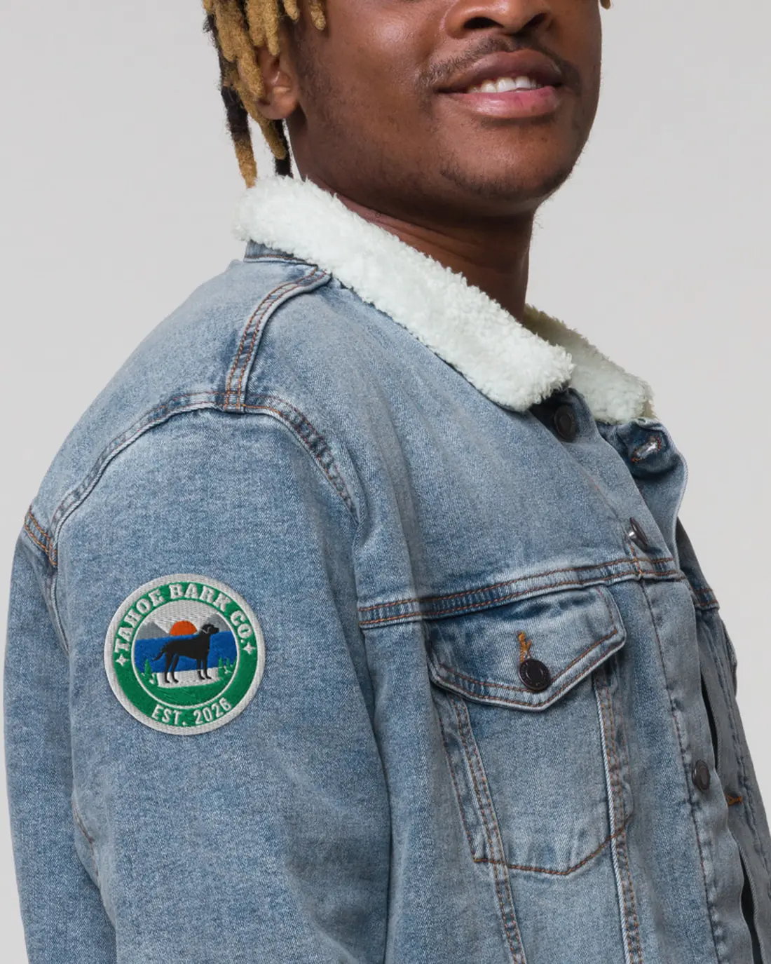 The Tahoe Bark Co. Patch, on the sleeve of a denim jacket.