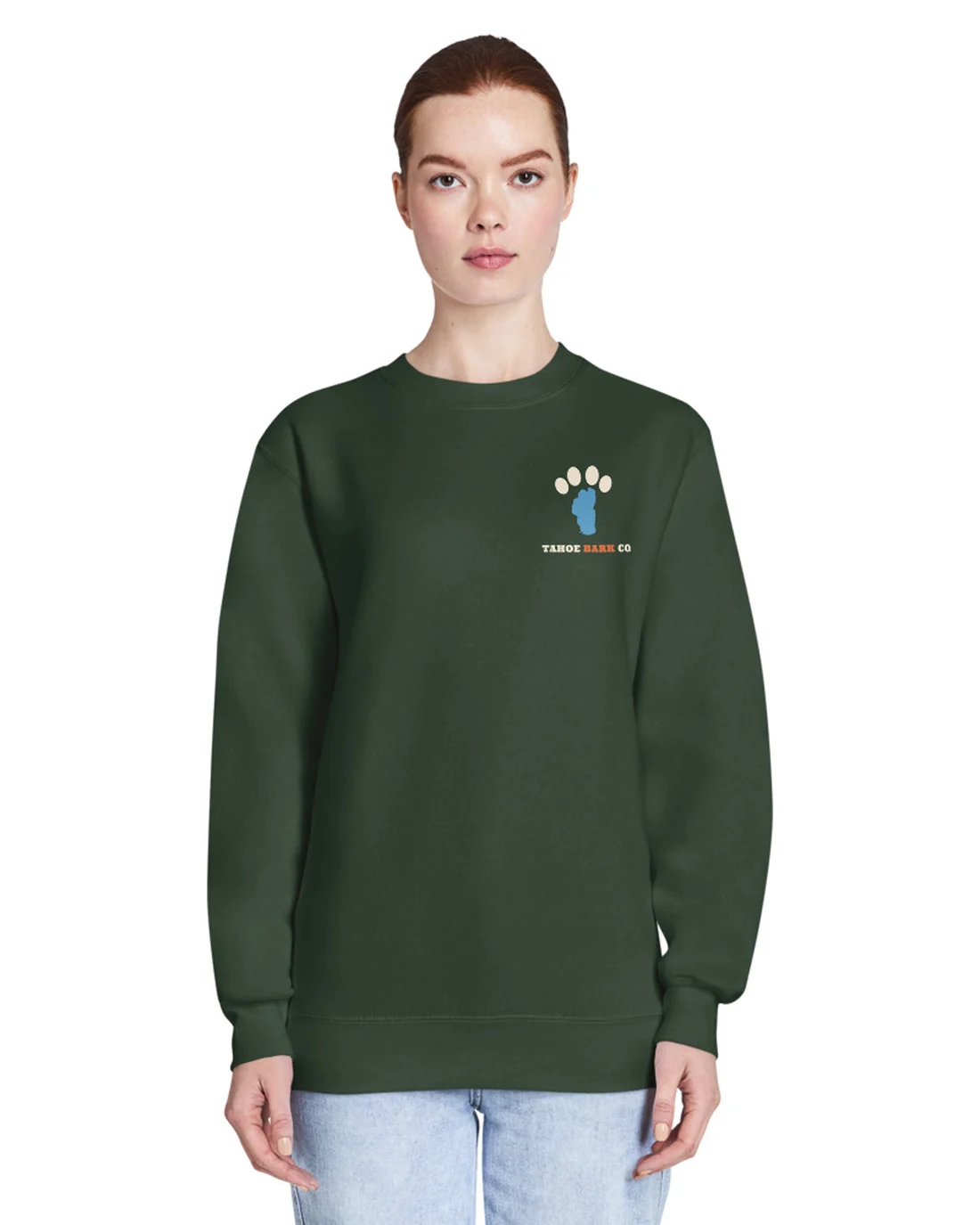 The front of the Window Seat crewneck, worn by a second model, with the Tahoe Bark Co. logo at the heart.