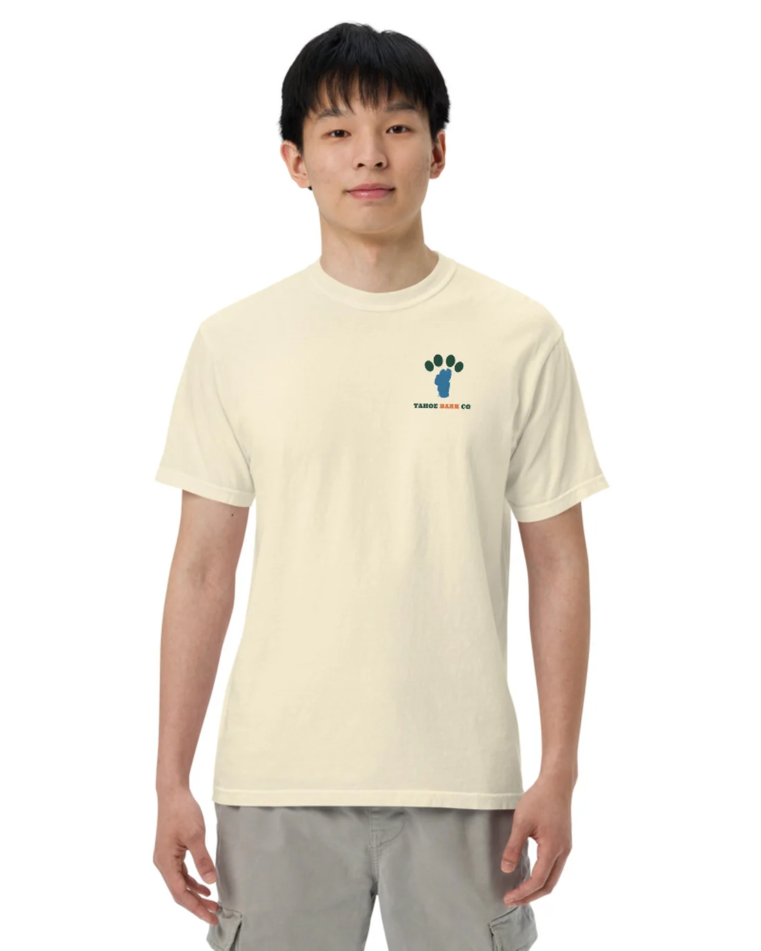 The front of the Dirty Dog tee, worn by a second model, with the Tahoe Bark Co. logo at the heart.