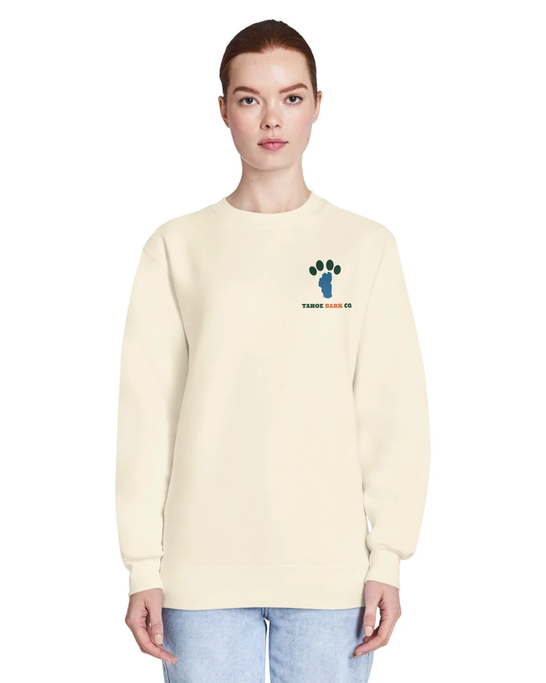 The front of the Lake Dog crewneck, worn by a second model, with the Tahoe Bark Co. logo at the heart.
