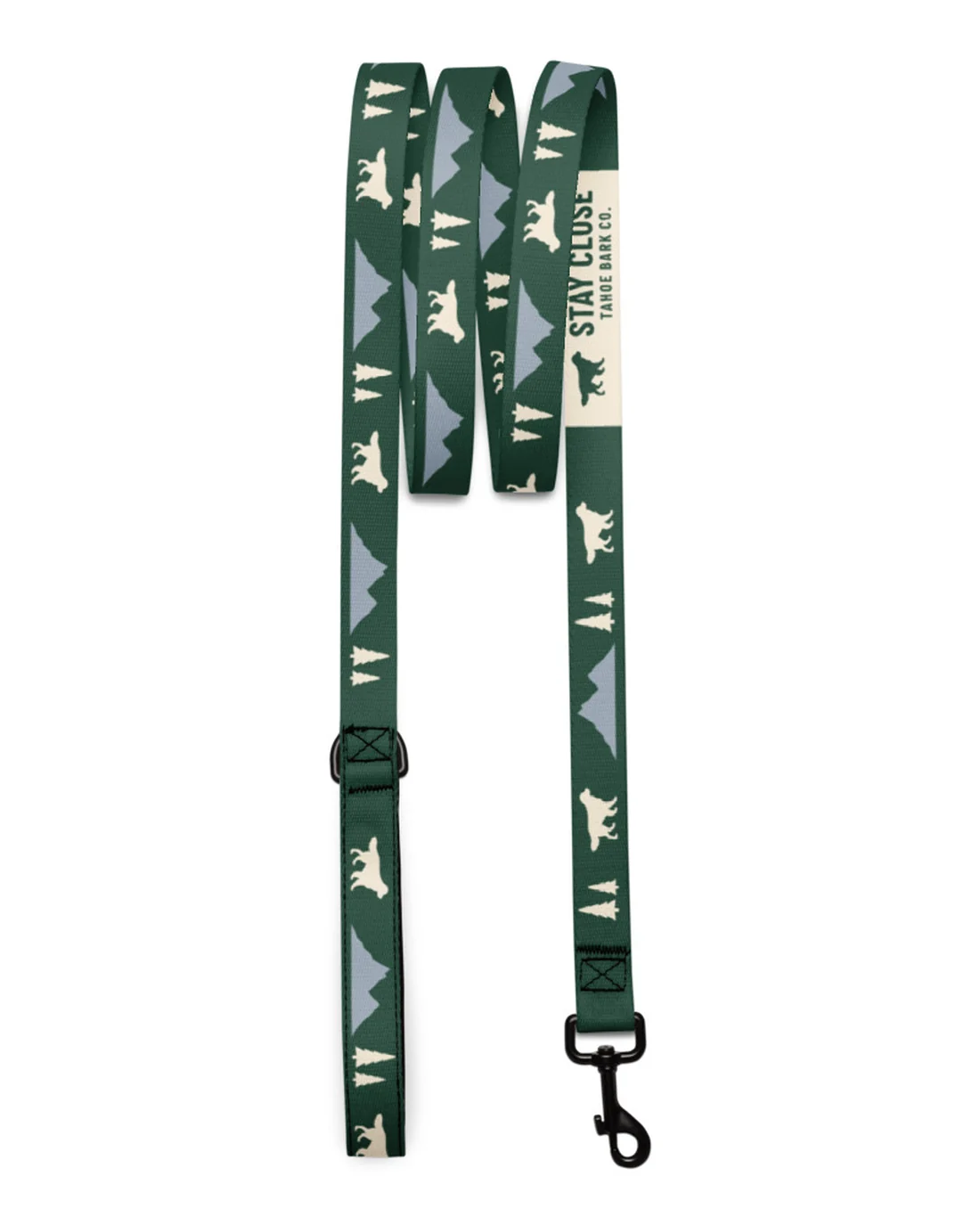 The Stay Close leash laid flat: retrievers, mountain ranges and pines in cream and granite on pine, the cream STAY CLOSE band near the black metal snap.