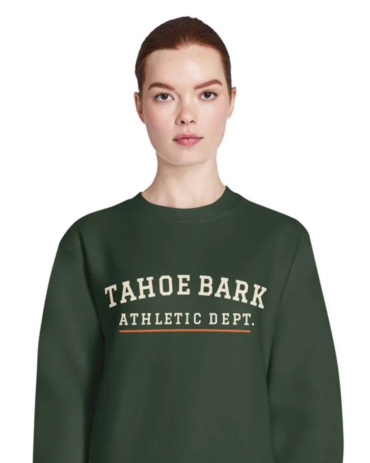 The Tahoe Bark Athletic Dept. design on a crewneck, worn by a model.