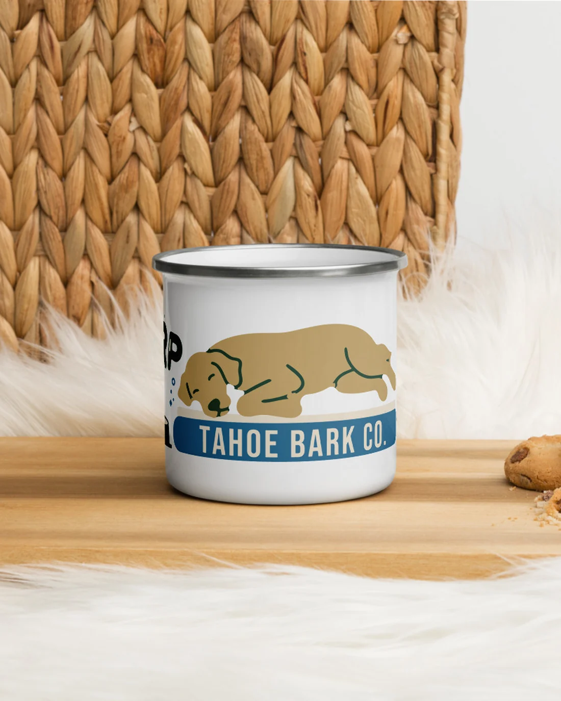 The Burp design on an enamel camp mug, on a wooden board.