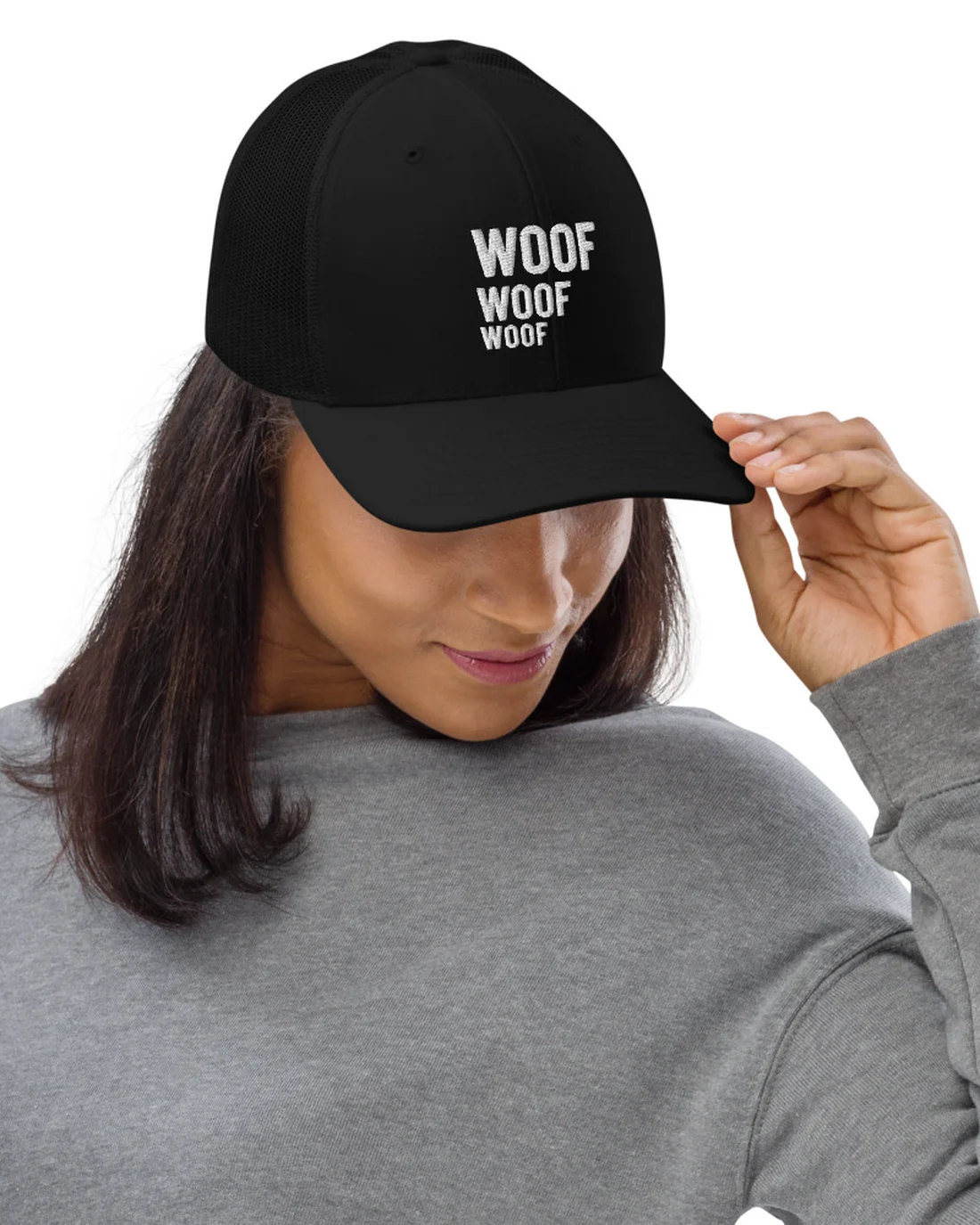 The Woof Woof Woof design on a trucker cap, worn by a model.