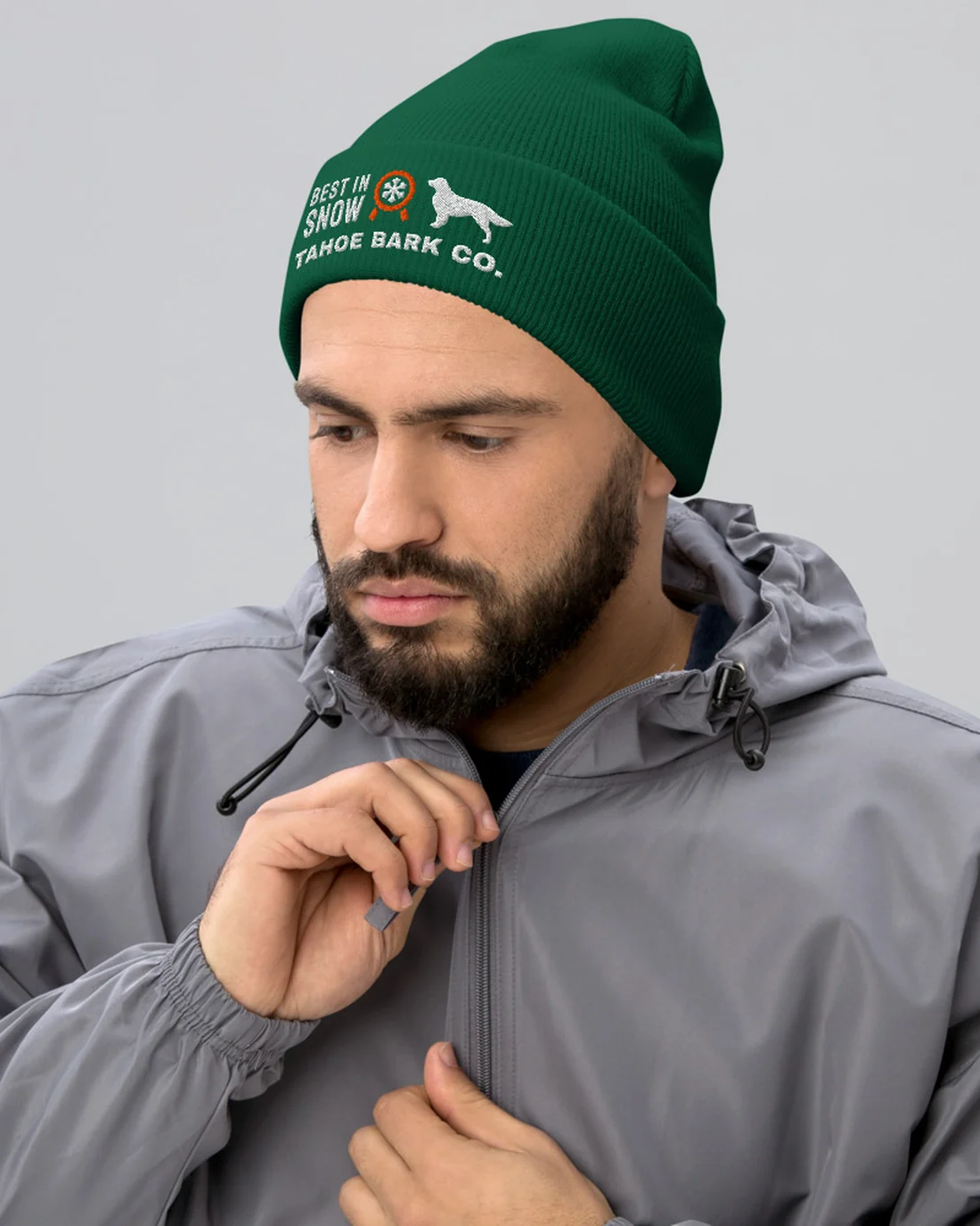 The Best in Snow design on a beanie, worn by a model.
