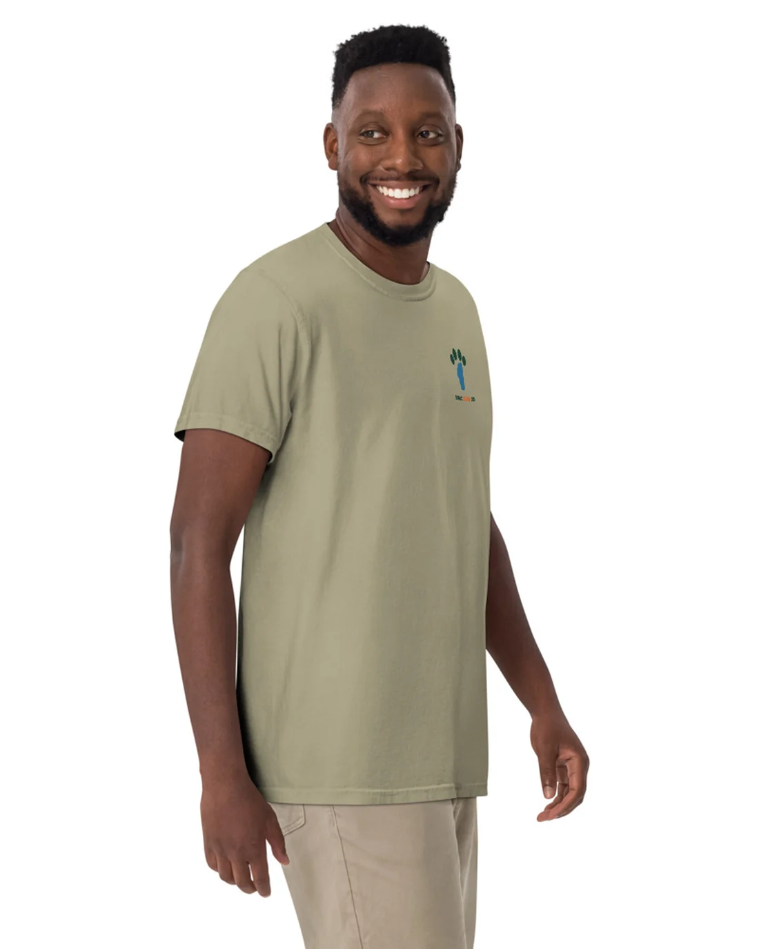 The front of the Trailhead Committee tee, worn by a second model, with the Tahoe Bark Co. logo at the heart.